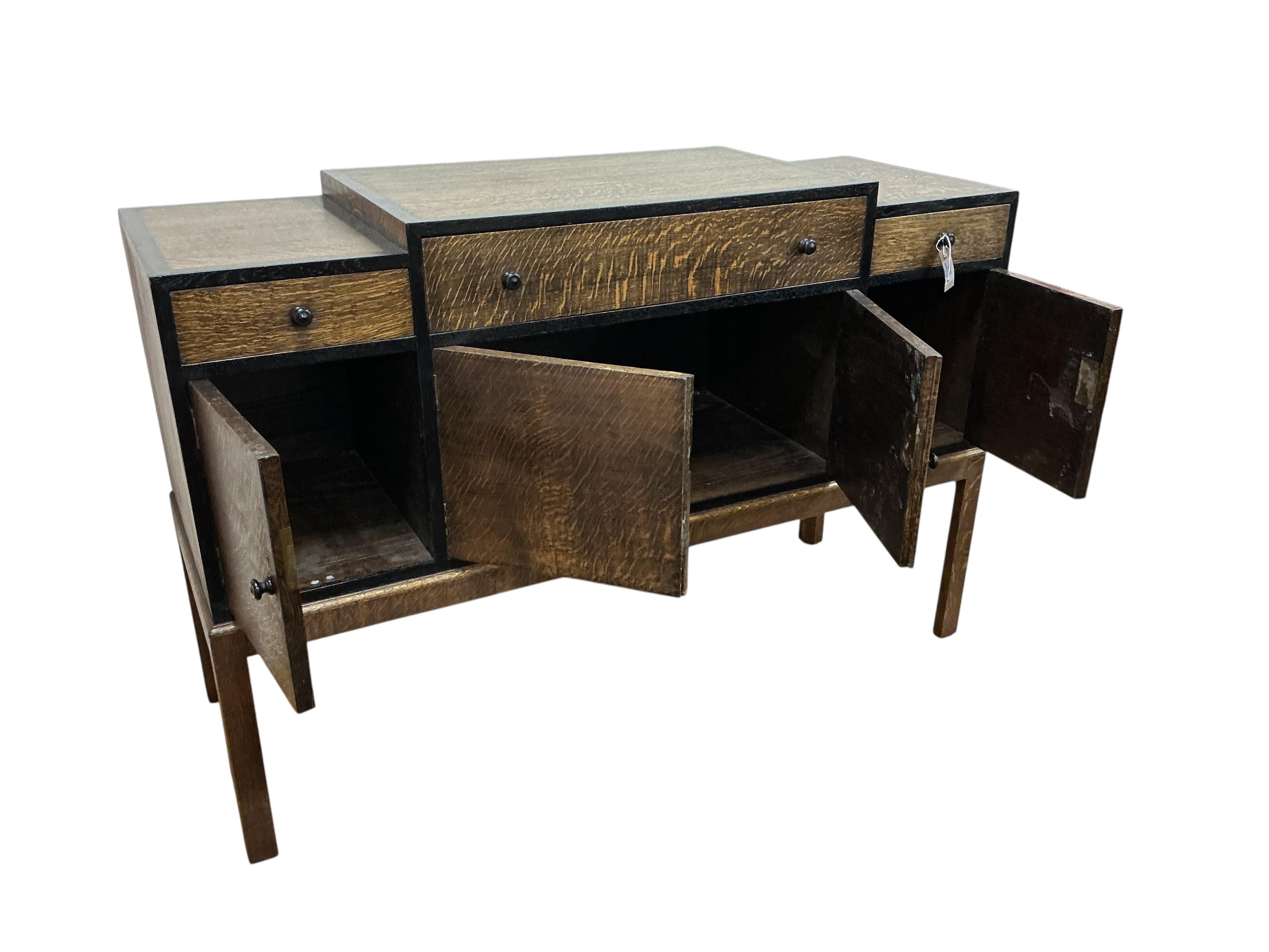 A Heals Art Deco oak and ebony sideboard, width 137cm, depth 49cm, height 92cm.